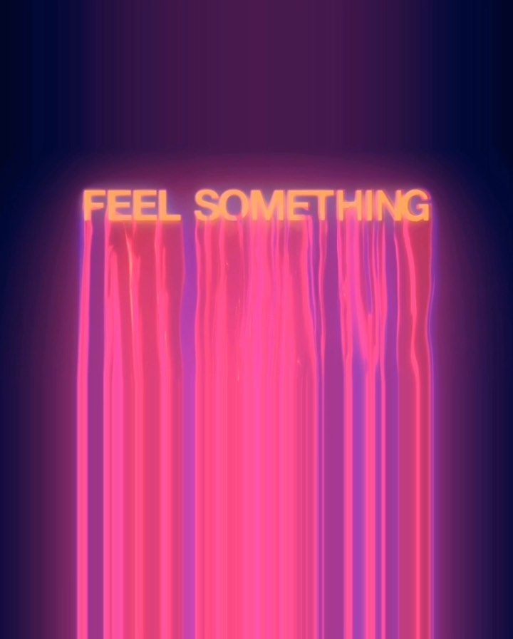 the words feel something are lit up in pink and purple