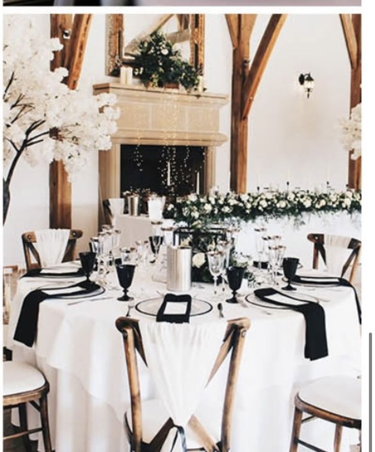 the tables are set with black and white linens for an elegant wedding breakfasteon