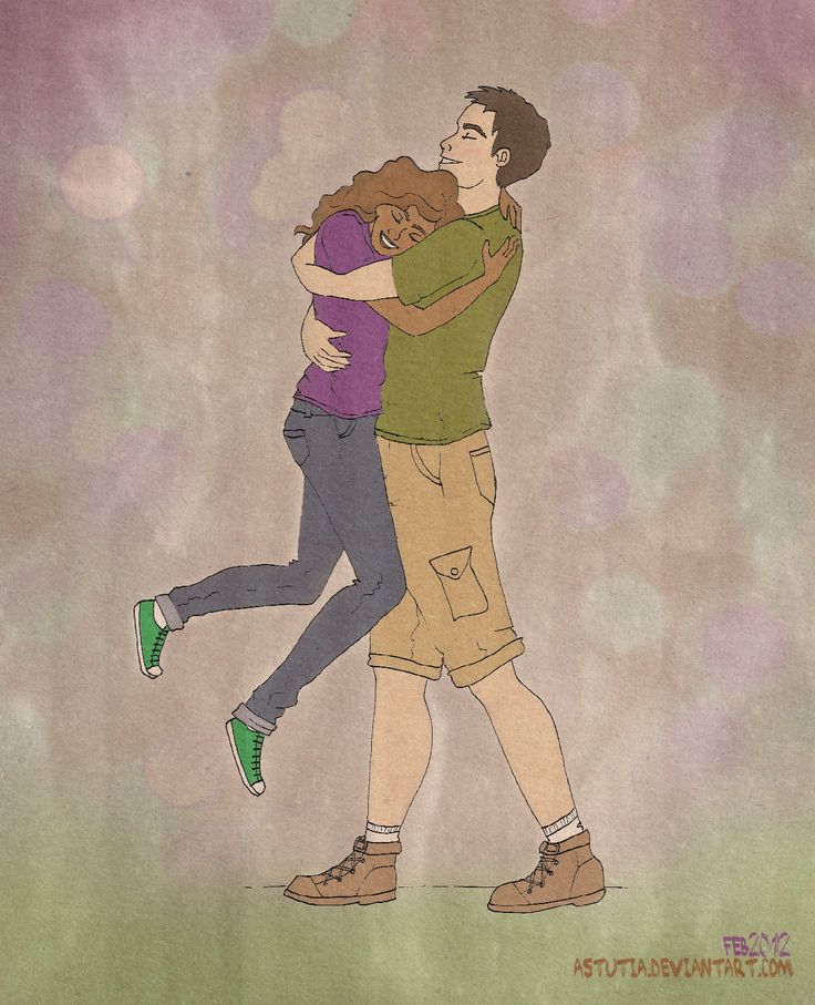 two people hugging each other while standing in front of a purple and green background with bubbles