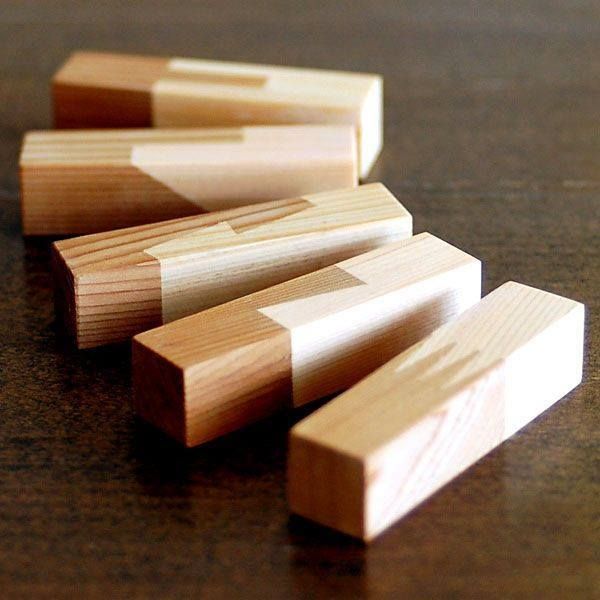 several pieces of wood sitting on top of a table