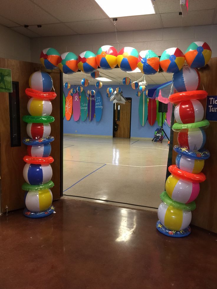 an entrance to a school decorated with balloons