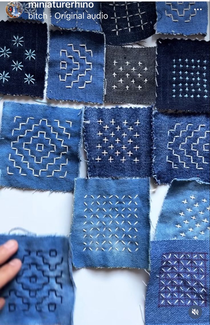 several pieces of denim with stitchs and holes on them are laid out in the shape of squares