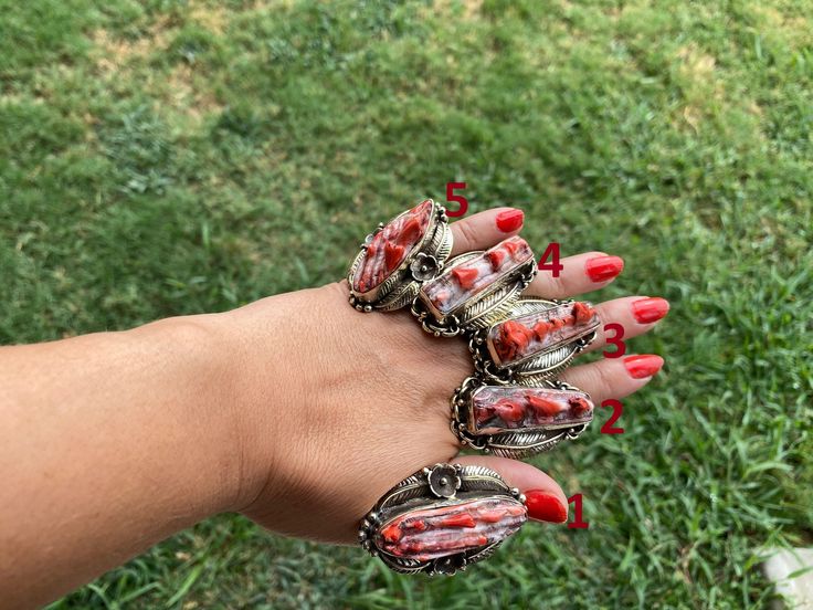 This listing is for 1 piece. At wholesale price Made with Tibetan Silver, Natural Orange Spiny Oyster Ring Size: Adjustable (One size fits most) can size up or down Stone: Natural Orange Spiny Oyster Measurement: No # 1.  Ring: Approximately 50 mm X 30 mm ( From widest Side) , Weight: 28.70 gm No # 2. Ring: Approximately 52 mm X 30 mm ( From widest Side), Weight: 29.40 gm No # 3. Ring: Approximately 50 mm X 30 mm ( From widest Side), Weight: 31.30 gm  No # 4. Ring: Approximately 48 mm X 30 mm ( Oyster Jewelry, Spiny Oyster Jewelry, Ocean Treasures, Divine Connections, Native American Style, Ocean Colors, Shell Pattern, Spiny Oyster, Native American Fashion