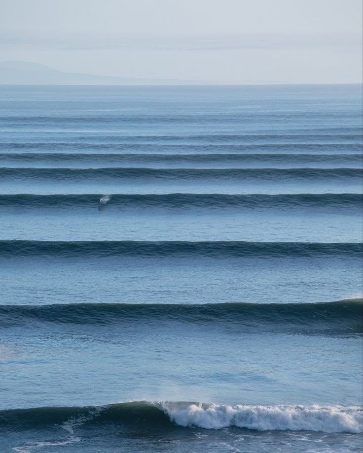 two surfers are riding the waves in the ocean