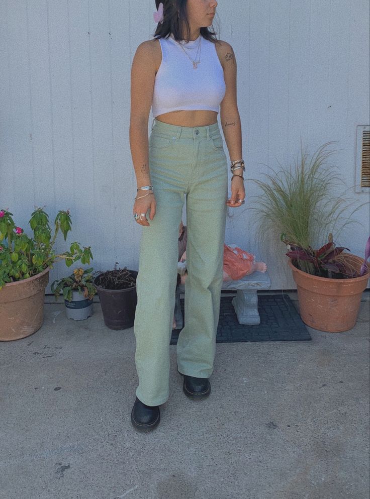 #mintgreen aesthetic #tattoo #flaredjeans #pastels #outfits #aestheticoutfits Pastel Green Jeans Outfit, Green Flared Jeans Outfit, Pastel Jeans Outfit, Mint Green Jeans Outfit, Light Green Jeans Outfit, Pastel Green Pants Outfit, Green Jeans Outfit Aesthetic, Green Pants Outfit Aesthetic, Mint Jeans Outfit