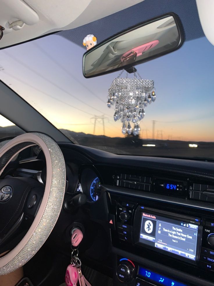 the interior of a car is decorated with crystal beads