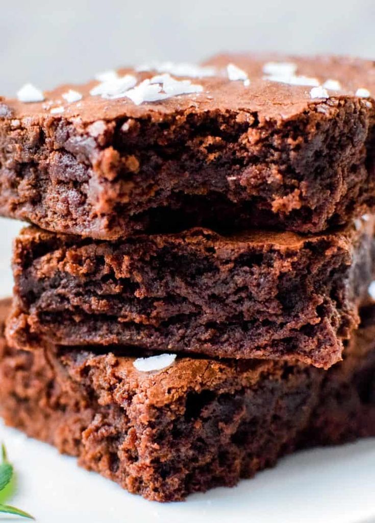 three chocolate brownies stacked on top of each other