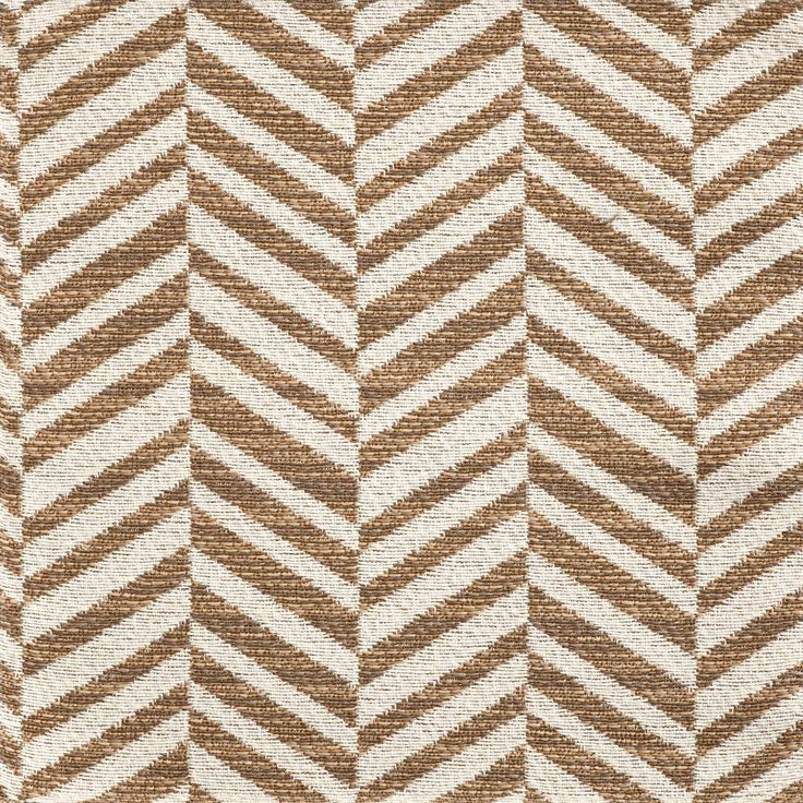 a brown and white chevroned pattern on fabric