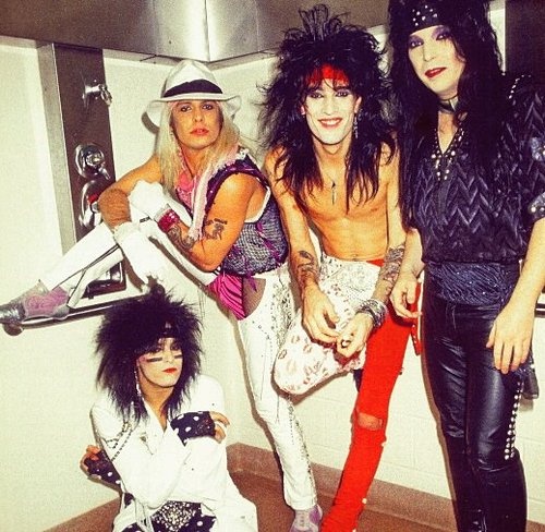 the group of people are posing together in their dressing room, dressed up for halloween