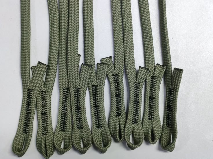 four different types of green rope on a white surface