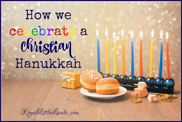 a plate with donuts on it next to candles and other items for hanukkah