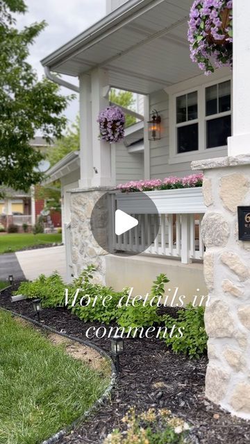 the front entrance to a home with flowers and plants