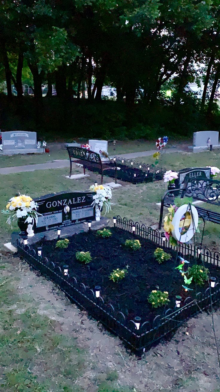 the cemetery is decorated with flowers, candles and headstones for those who have passed their lives