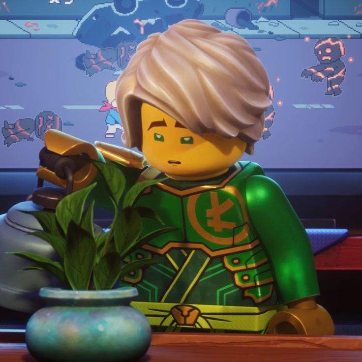 a lego man sitting next to a plant in front of a tv