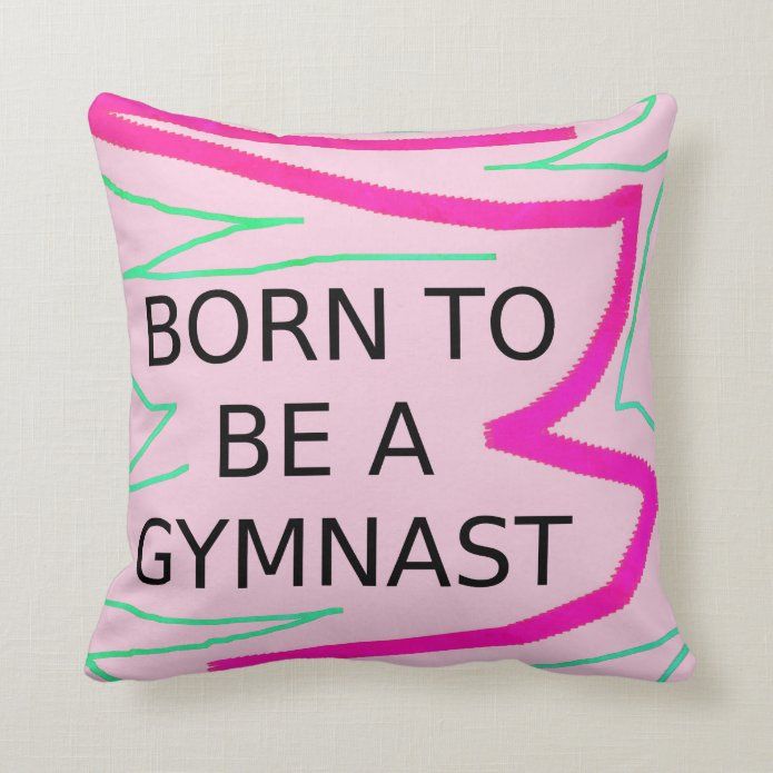 a pillow with the words born to be a gymnast printed in black and pink