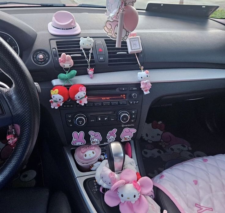 the interior of a car with hello kitty decorations