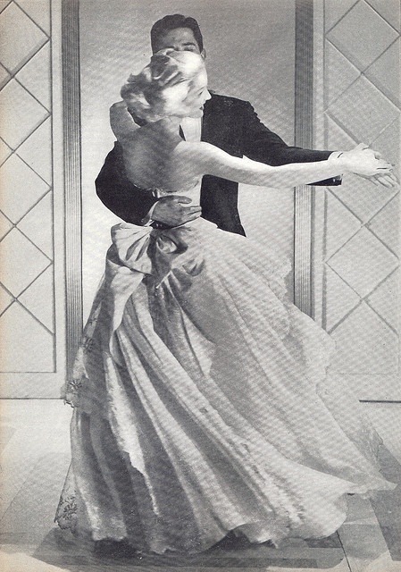 an old fashion photo of a man and woman in formal dress dancing the charleston swing