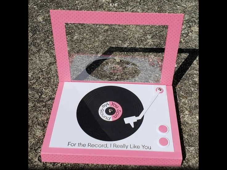 a pink record box sitting on the ground