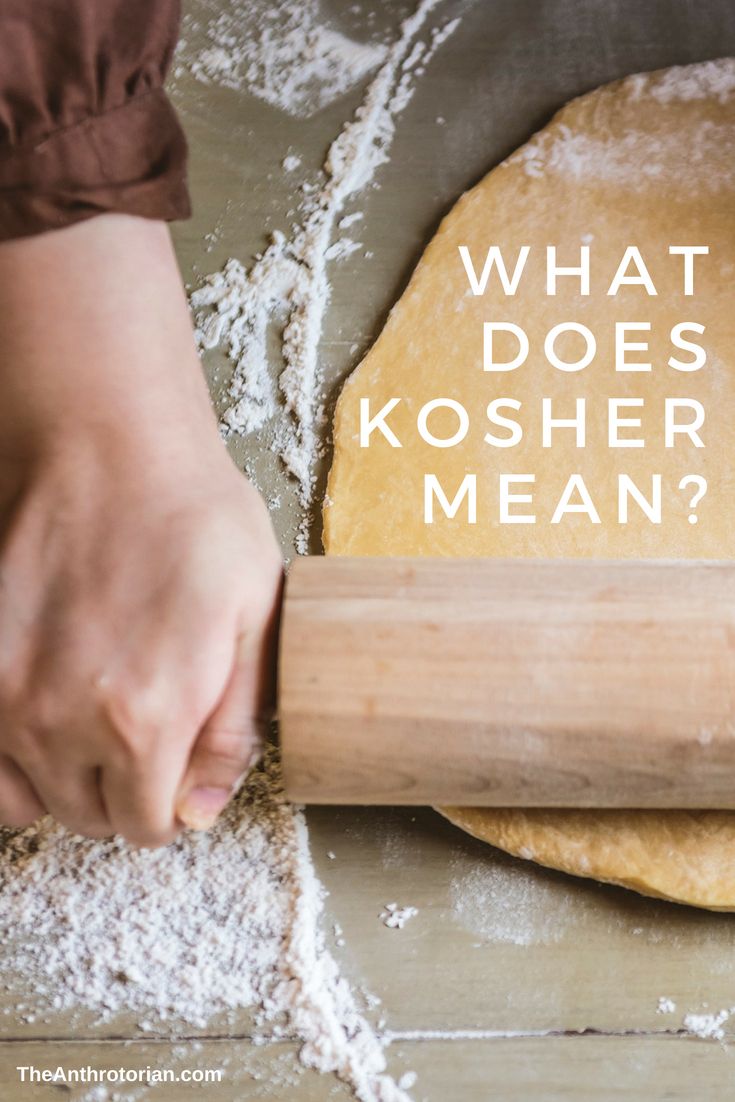 a person rolling out dough on top of a wooden board with the words what does kosher mean?