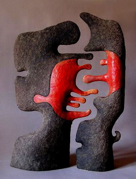 an abstract sculpture with red and black shapes