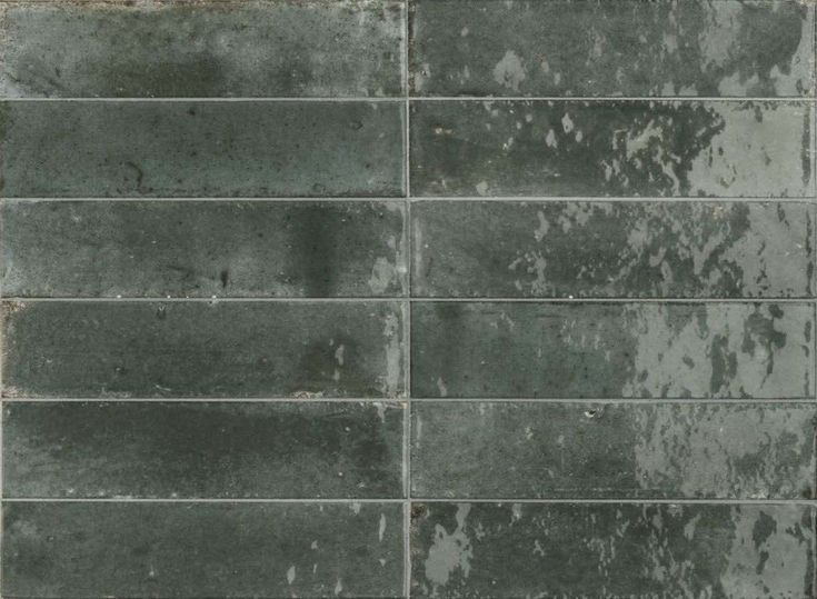 an old brick wall is shown in grey