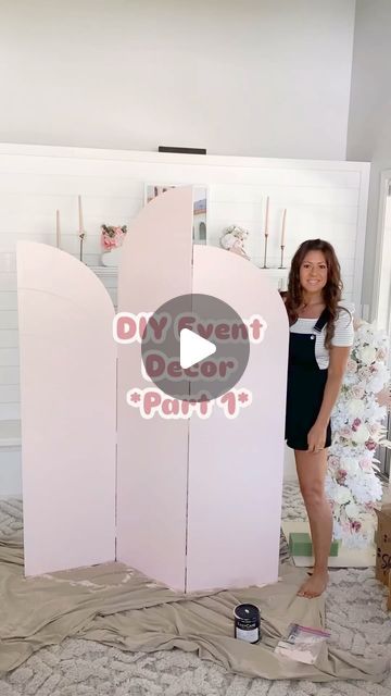 a woman standing in front of a pink door with the words diy doesn't party written on it