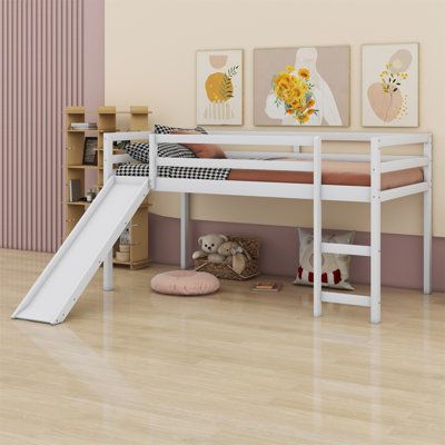 a child's bed with a slide in front of it