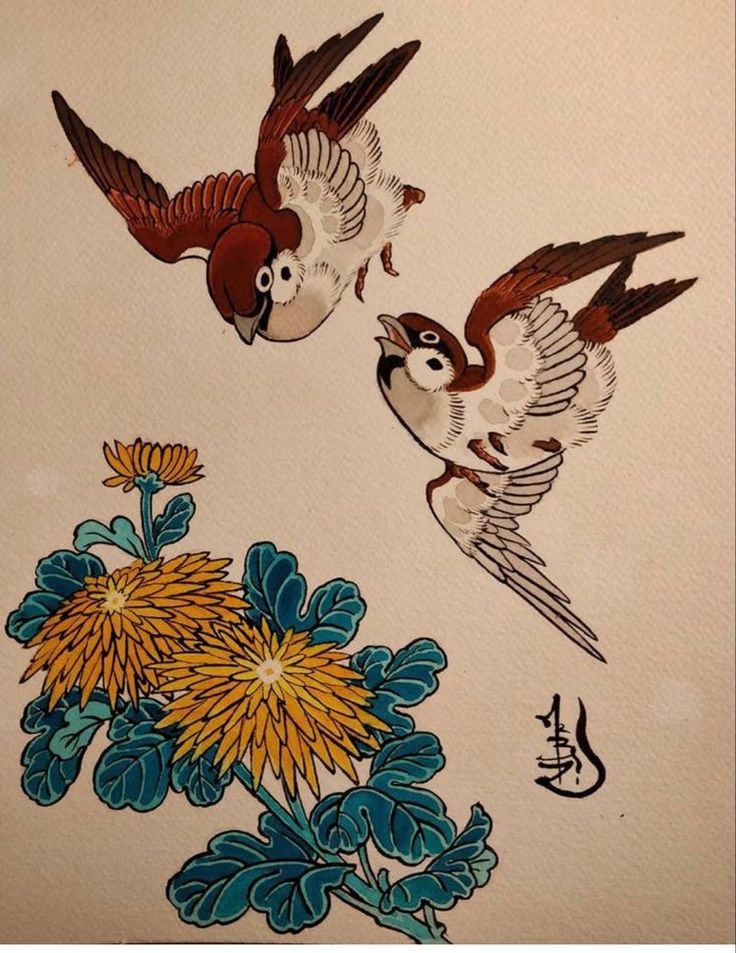 two birds flying next to each other on a white wall with blue and yellow flowers