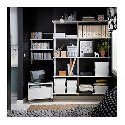 a bedroom with black walls and white shelves