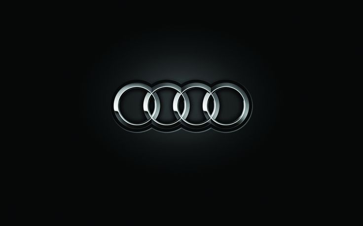 an audi logo is shown in the dark