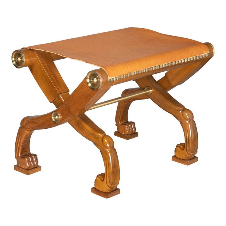 a small wooden bench with metal fittings on it's legs and footrests