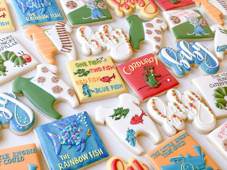 many decorated cookies are displayed on a table