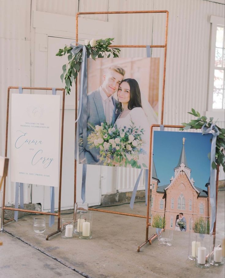 a couple is posing in front of their wedding pictures