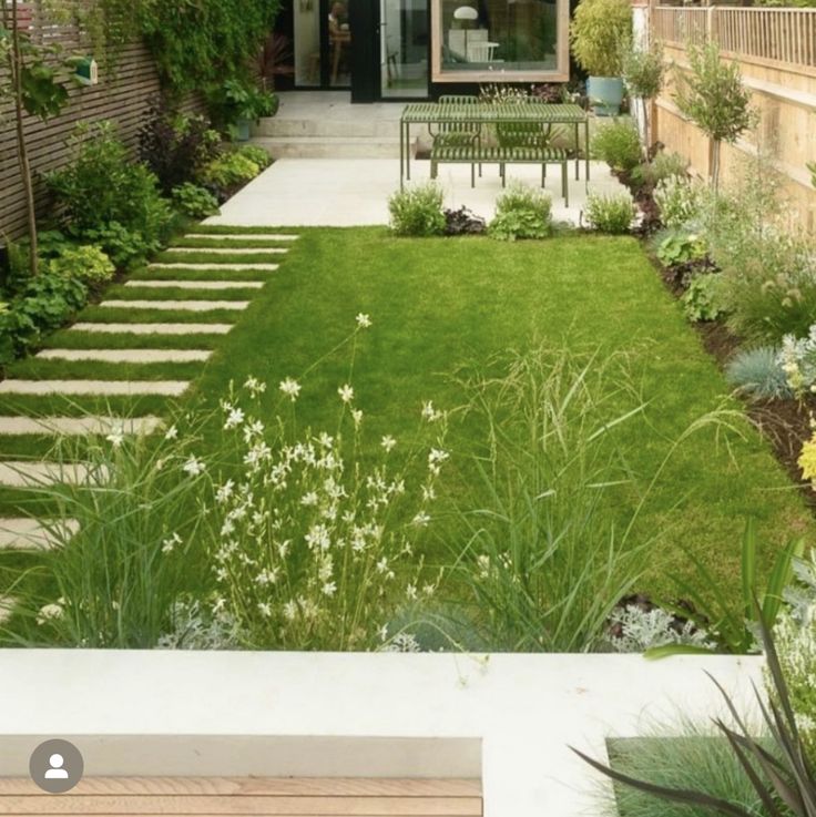 an outdoor garden with grass and flowers