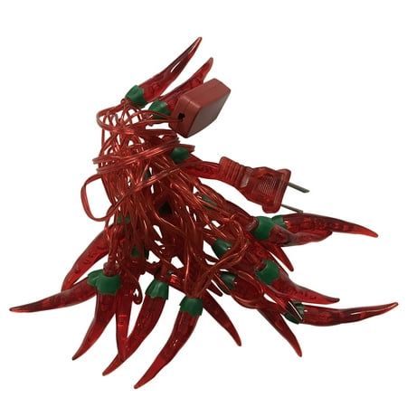 red chili peppers with green tips are hanging from a string on a white background for decoration