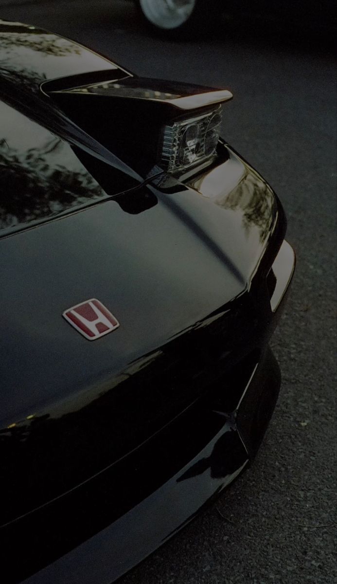 the front end of a black sports car