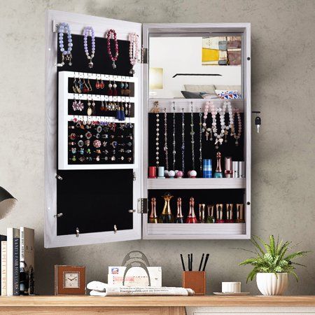 a white cabinet filled with lots of jewelry