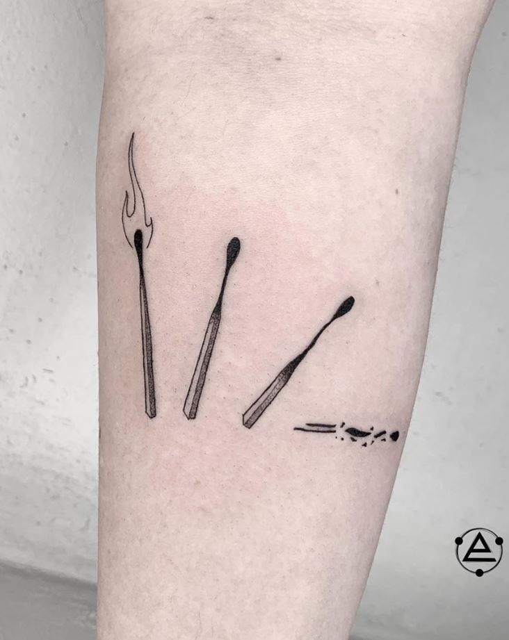 three forks and spoons tattoo on the leg