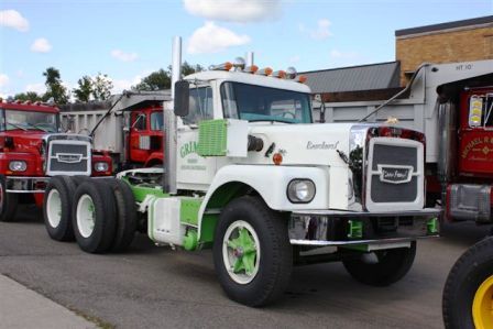 several trucks are lined up in a parking lot