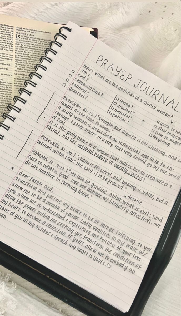 an open bible with the words prayer journal written on it next to a cup of coffee