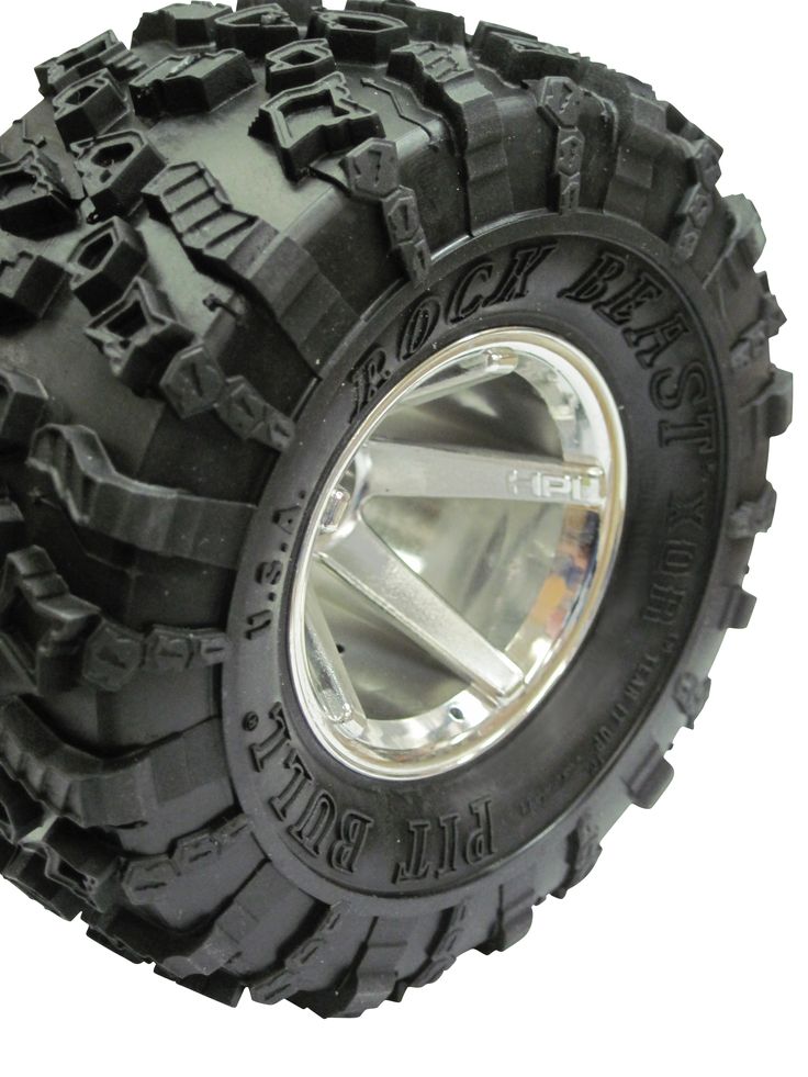 an off - road tire on a white background