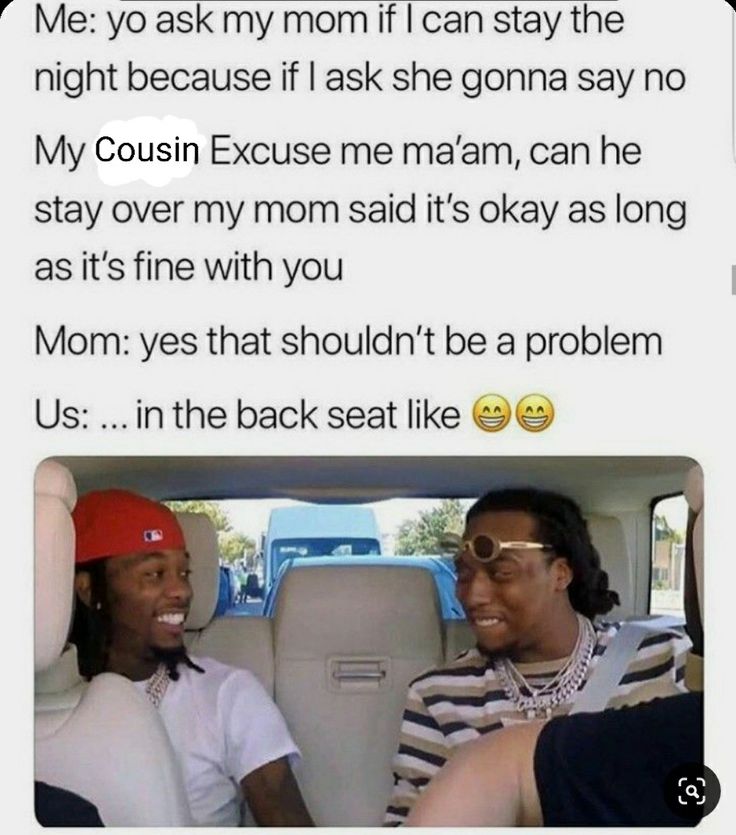 two people sitting in the back seat of a car with one person talking to another