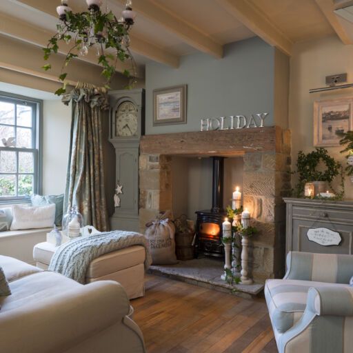 a living room filled with furniture and a fire place