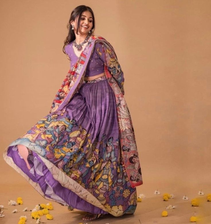 lehenga set  |womens kalamkari lehenga choli |crop top lehenga set |designer kalamkari lehenga dupatta | wedding lehenga choli | hand painted kalamkari lehenga usa Women's lehenga set /kalamkari embroidered lehenga skirt/voggish      lehengas are one of the beautiful and versatile traditional attires of india !! we carry such pieces in budget with great quality that can be styled in multiple ways with different outfits !!       Here is Beautiful lehenga set in lavender with pure silk hand painted authentic kalamkari set in which skirt has hand painted big border pattern  paired with matching full sleeve hand embroidered kalamkari blouse as shown!! This set comes with contrast all over kalamkari hand painted dupatta as shown , skirt has heavy gear and both pieces can be mix and matched with Luxury Blouse Piece With Kalamkari Print For Puja, Luxury Semi-stitched Kalamkari Blouse Piece, Unstitched Kalamkari Wedding Choli, Unstitched Wedding Choli With Kalamkari Print, Unstitched Anarkali Set With Kalamkari Print For Wedding, Bollywood Style Kalamkari Print Sharara For Wedding, Wedding Anarkali Set With Kalamkari Print, Designer Bohemian Sharara With Kalamkari Print, Wedding Lehenga With Kalamkari Print In Traditional Drape