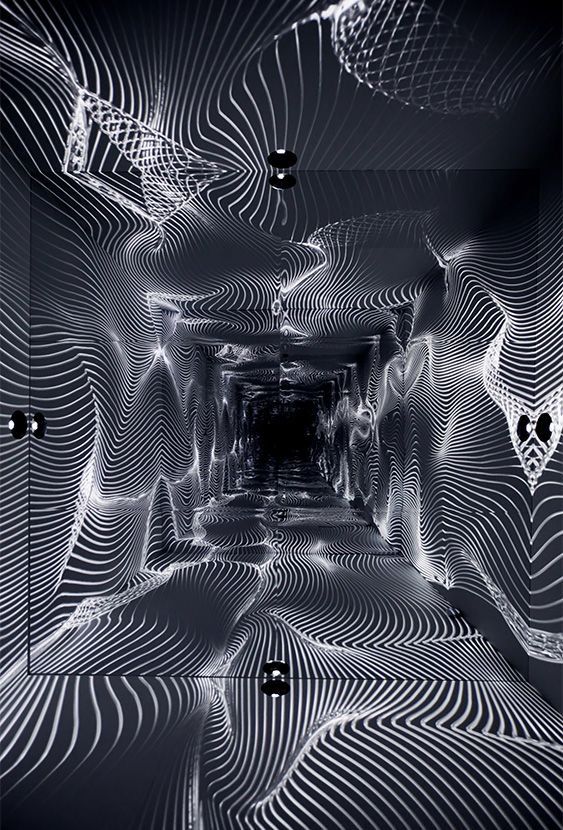 an abstract photo with lines and shapes in black and white, as well as the light at the end of the tunnel