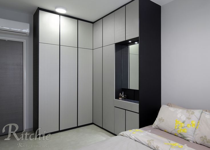 a white and black bedroom with a sink