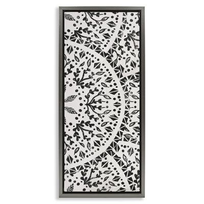 an intricately designed paper cutting board with black and white designs on the edges,