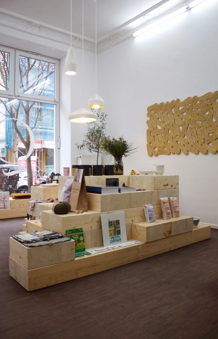 a room filled with lots of wooden boxes