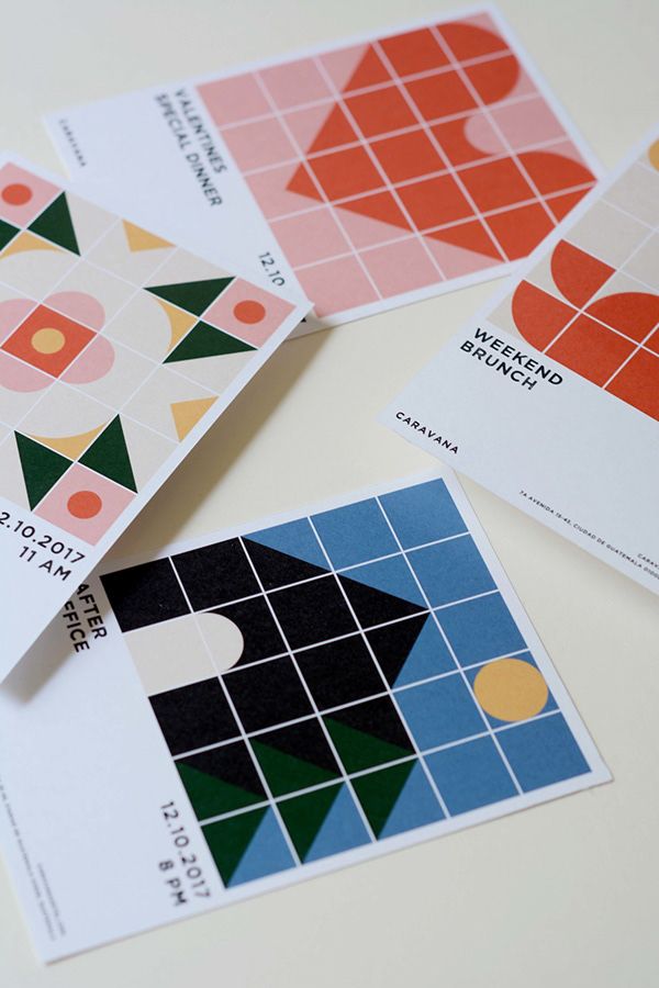 four different business cards on top of each other with geometric shapes and lines in them