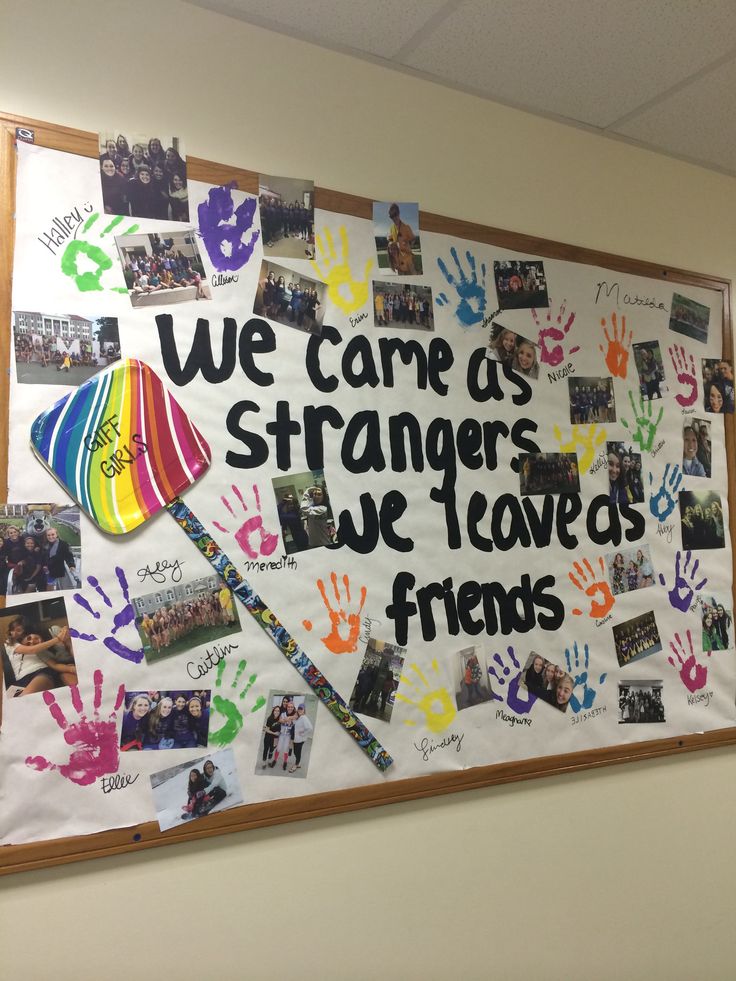 a bulletin board with handprints on it that says we care as strangers we leave friends